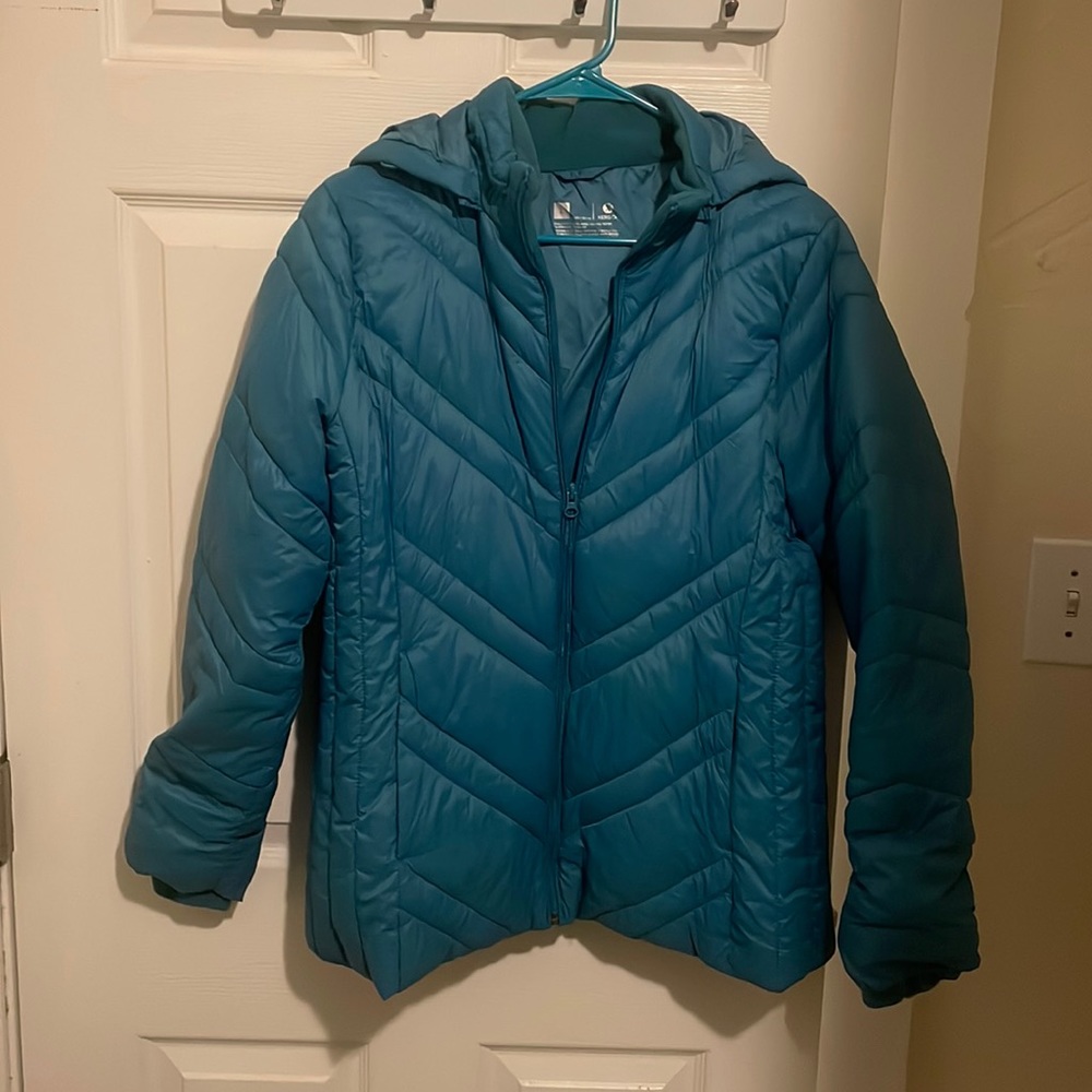 Teal puffer jacket.